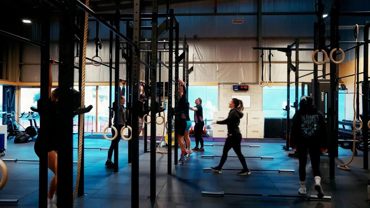 Busy Australian gym with members and coaches