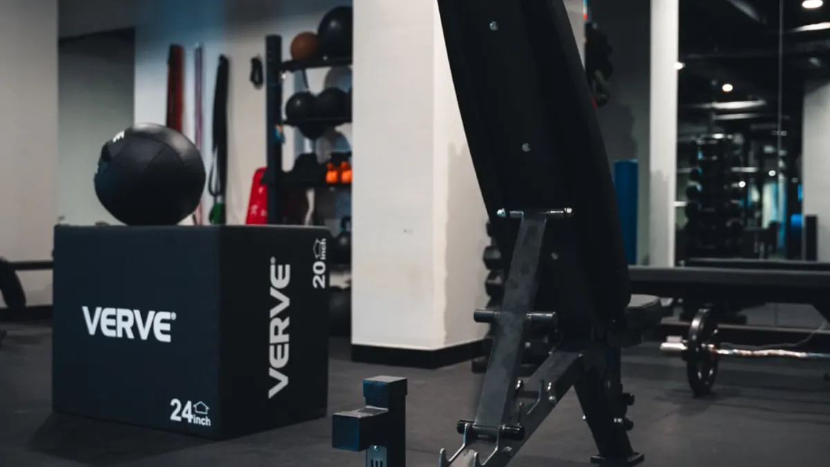 Pin-loaded commercial strength machine in a completed fitout