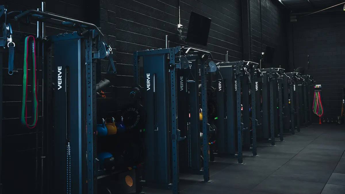 Connected strength equipment across a commercial gym floor